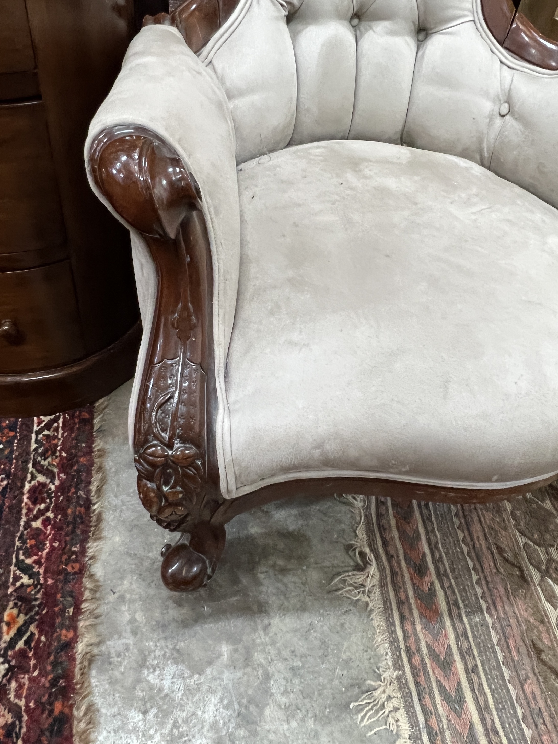 A Victorian style faux suede mahogany spoon back armchair, width 70cm, depth 82cm, height 100cm